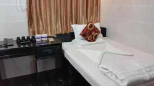 Un pat sau paturi într-o cameră la New hoover hostel