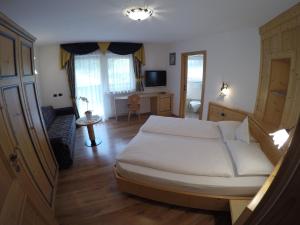 Posteľ alebo postele v izbe v ubytovaní Garni Hotel and Apartments Wildbach