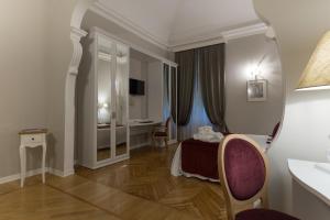 a hotel room with a bed and a desk at Mediterraneo Emotional Hotel & Spa in Santa Margherita Ligure
