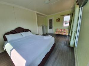 Voodi või voodid majutusasutuse Phalagoon Resort toas