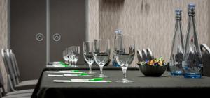 a row of wine glasses on a table at Holiday Inn Edmonton South - Evario Events, an IHG Hotel in Edmonton