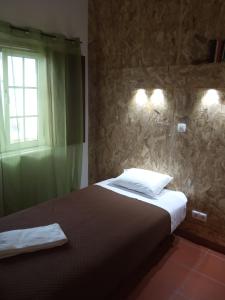 Uma cama ou camas num quarto em Hostel Nature