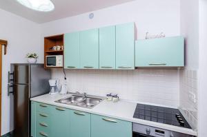 Kuchyň nebo kuchyňský kout v ubytování Antares Apartments