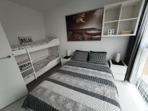 Posteľ alebo postele v izbe v ubytovaní Horyzont