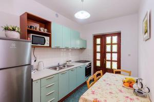 Kuchyň nebo kuchyňský kout v ubytování Antares Apartments