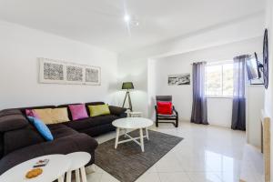 a living room with a couch and a table at Amazing apartment in Albufeira in Albufeira