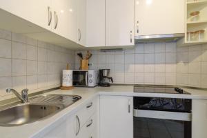 Kuchyň nebo kuchyňský kout v ubytování Apartment Marijana