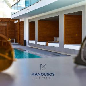 Bazén v ubytovaní Manousos City Hotel alebo v jeho blízkosti