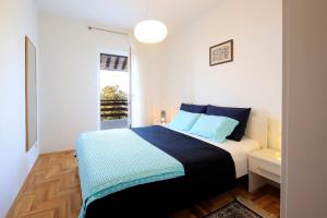 Posteľ alebo postele v izbe v ubytovaní Apartment Vincent with beautiful sea view terrace