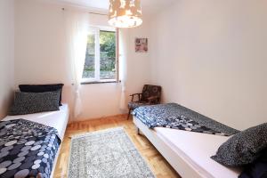 Posteľ alebo postele v izbe v ubytovaní Apartment Vincent with beautiful sea view terrace