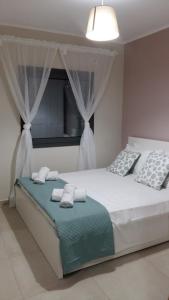 A bed or beds in a room at VILLA ANTHIMOS
