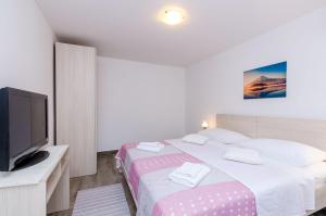 Ein Bett oder Betten in einem Zimmer der Unterkunft Guesthouse Matusic