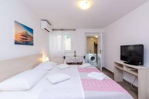 Ein Bett oder Betten in einem Zimmer der Unterkunft Guesthouse Matusic