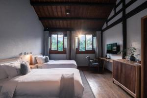 Postel nebo postele na pokoji v ubytování Huanghsan SU House