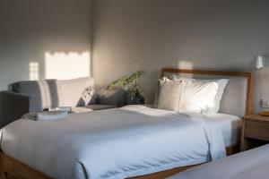Postel nebo postele na pokoji v ubytování Huanghsan SU House