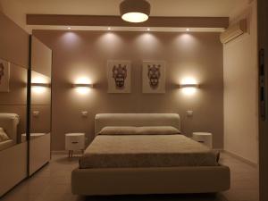 Кровать или кровати в номере Villa Manzella piscina privata