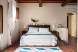 Voodi või voodid majutusasutuse Borgo I Vicelli Adults Only Relais toas