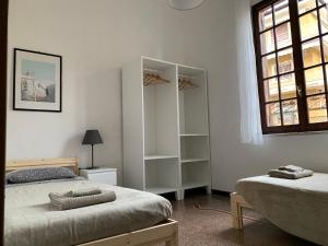 מיטה או מיטות בחדר ב-Casa indipendente a 200 metri dal mare