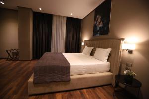 Postel nebo postele na pokoji v ubytování Supreme Hotel