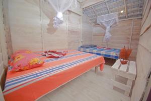 Postel nebo postele na pokoji v ubytování Ceylon Beach Home
