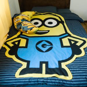 a bed with a cartoon character on top of it at 林林の民宿-関空直達、minion room 小黄人主题房 in Osaka