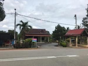 a building on the side of a street with at OPRO S&S Homestay Pagoh Malay Only in Muar