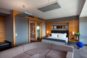 a hotel room with a bed and a couch at Point Hotel Barbaros in Istanbul +47 photos