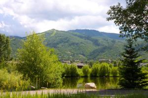 a view of a lake with a mountain in the background at Holiday Inn Steamboat Springs, an IHG Hotel in Steamboat Springs
