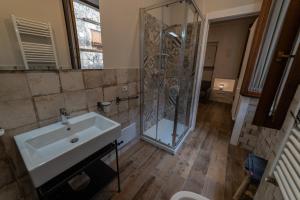 a bathroom with a sink and a shower at Alla cava Orvieto in Orvieto