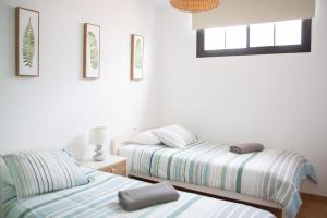 A bed or beds in a room at Arena Blanca