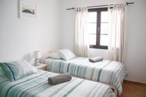 A bed or beds in a room at Arena Blanca
