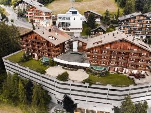 an overhead view of a large building with a yard at Hôtel Chalet Royal in Veysonnaz