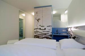 Postel nebo postele na pokoji v ubytování Hotel New Orleans