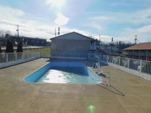 a swimming pool on the roof of a building at Days Inn by Wyndham Huntington in Pea Ridge