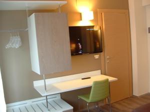 Kuchyň nebo kuchyňský kout v ubytování Hotel Toscana