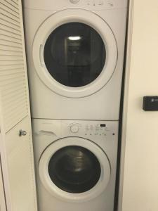 a washing machine and a dryer in an airplane at Venice One Bedroom Artist Bungalow in Los Angeles