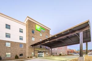 a hotel with a sign on the side of a building at Holiday Inn Express Shawnee, an IHG Hotel in Shawnee