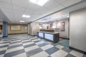 an office lobby with a checkered floor at Holiday Inn Express Shawnee, an IHG Hotel in Shawnee