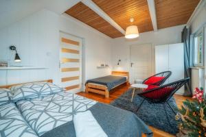 Posteľ alebo postele v izbe v ubytovaní Gabi Apartament Zakopane