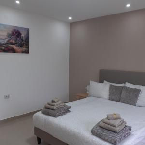 Postel nebo postele na pokoji v ubytování Apartman 4L