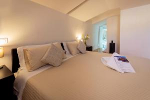 מיטה או מיטות בחדר ב-B&B Palazzo Satriano