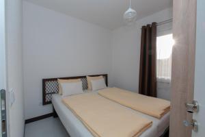 Giường trong phòng chung tại Hazam Apartmani +37 ảnh