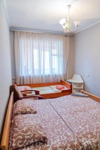 Кровать или кровати в номере Квартира по улице Большая Васильковская, 101