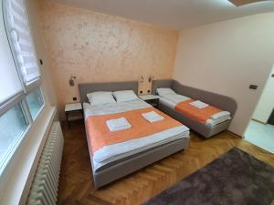 Postel nebo postele na pokoji v ubytování Apartman DoDoLu