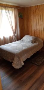 Postel nebo postele na pokoji v ubytování Cabaña Quiquel, Dalcahue, Chiloe