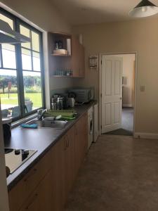 a kitchen with a sink and a counter top at Pahau Downs in Culverden