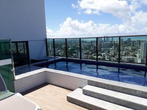 a swimming pool on the top of a building at Beach Class Ilha do Leite in Recife
