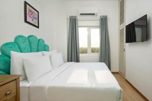 מיטה או מיטות בחדר ב-Adaline Hotel & Apartment
