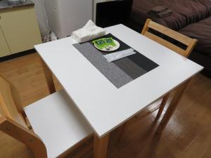 a white table with a plate of food on it at 札幌市中心部大通公園まで徒歩八分観光移動に便利なロケーションe507 in Sapporo