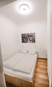 Posteľ alebo postele v izbe v ubytovaní Pacman Apartment